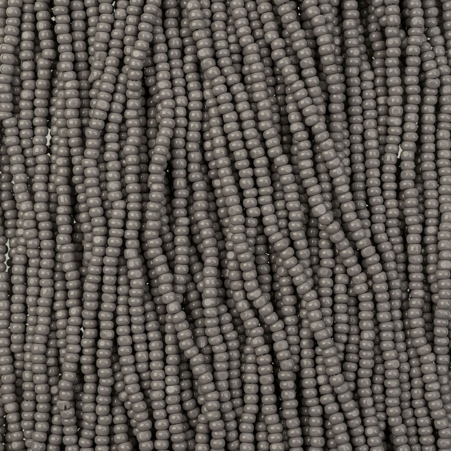 Czech Seed Bead 11/0 Cut Opaque Grey Strung