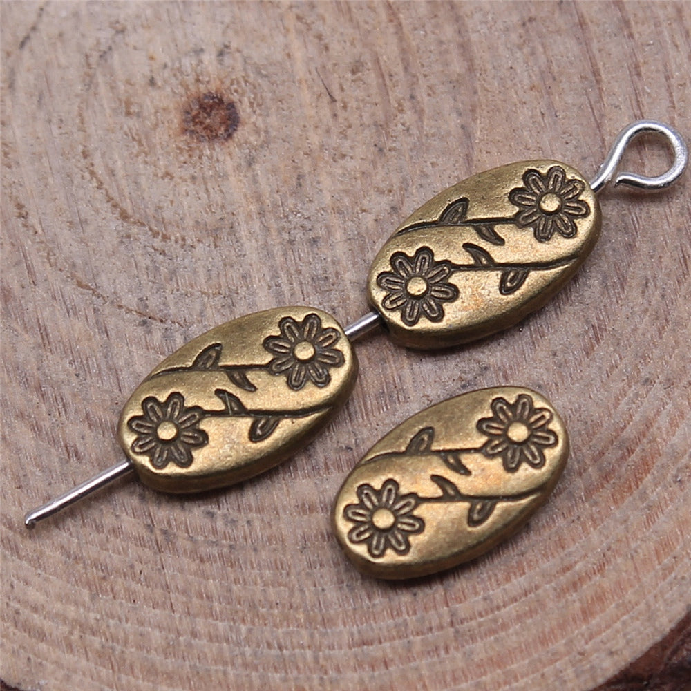 Tibetan Style Oval Flower Spacer Beads – Antique Silver or Antique Bronze (10x6mm) – Pack of 10 The Pink Bead Shop