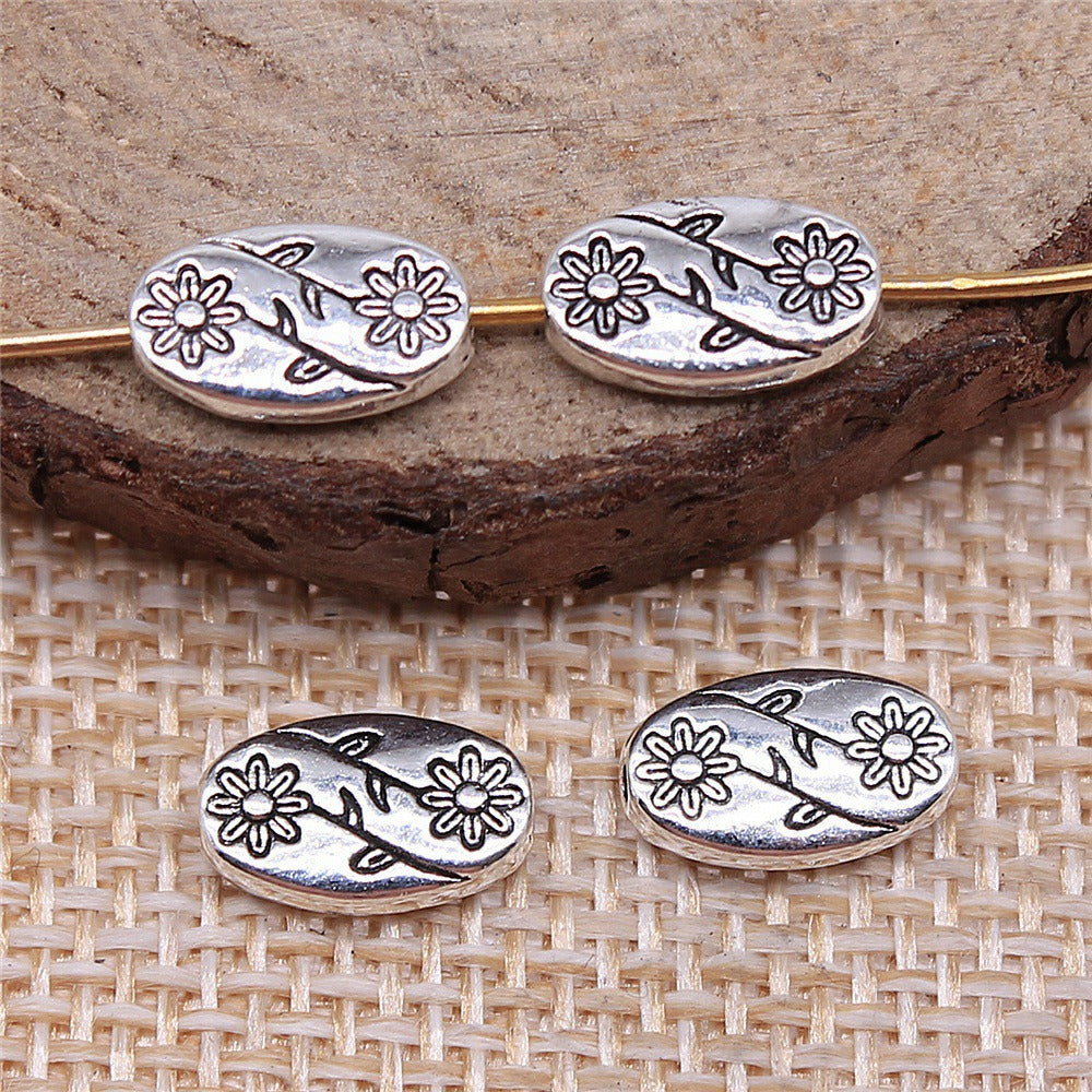 Tibetan Style Oval Flower Spacer Beads – Antique Silver or Antique Bronze (10x6mm) – Pack of 10 The Pink Bead Shop